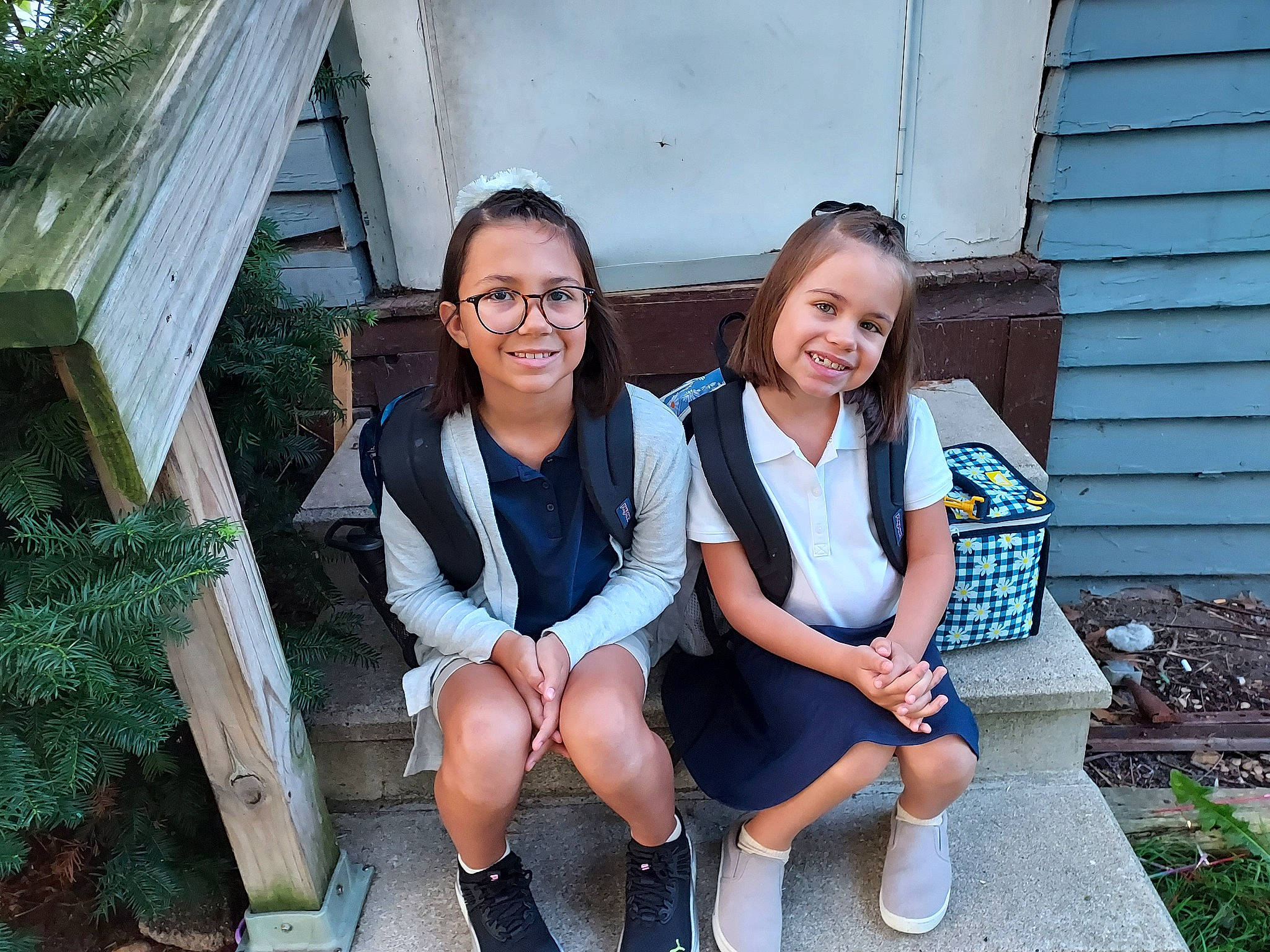 Maia joined the competition — help win amazing prizes! blue, event, face, fun, grass, happy, house, joy, leisure, people, person, plant, recreation, school_uniform, shoe, sitting, smile, sneakers, t_shirt, thigh