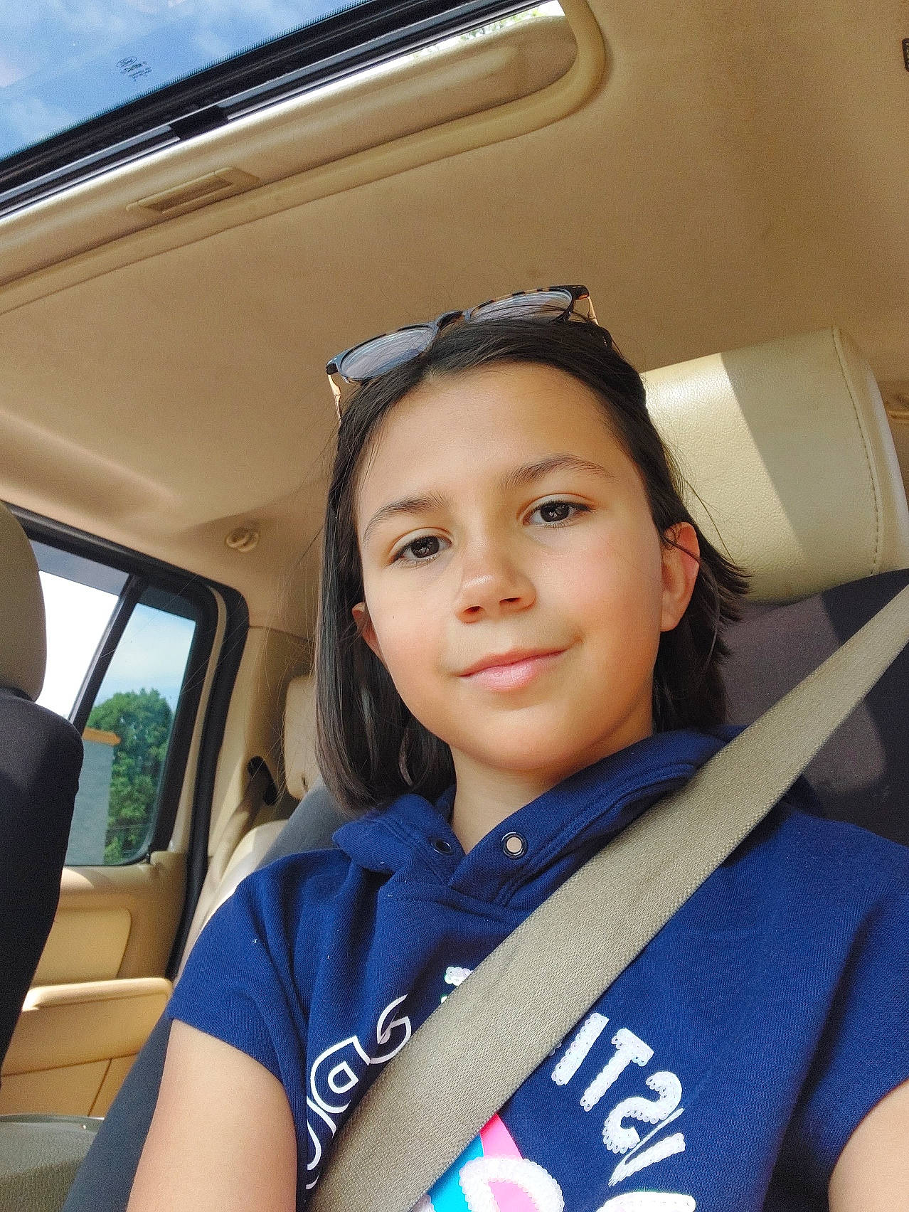 Maia is registered to the contest to win money with this photo: auto_part, automotive_design, automotive_exterior, black_hair, chin, electric_blue, eyewear, family_car, fun, hairstyle, joy, luxury_vehicle, motor_vehicle, person, sleeve, smile, snapshot, sunglasses, t_shirt, travel