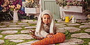 Marcel is registered to the contest to win money with this photo: animal, baby, bonnet, cat, clothing, costume, crawling, face, happy, hat, head, nature, outdoors, person, pet, photography, portrait, sitting, smile, yard