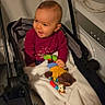 baby, blanket, candid, clothing, door, face, handlebar, happy, home, indoor, infant, nursery_pattern, plush_toy, power_socket, rattle, seat, smiling, stroller, toy, washing_machine