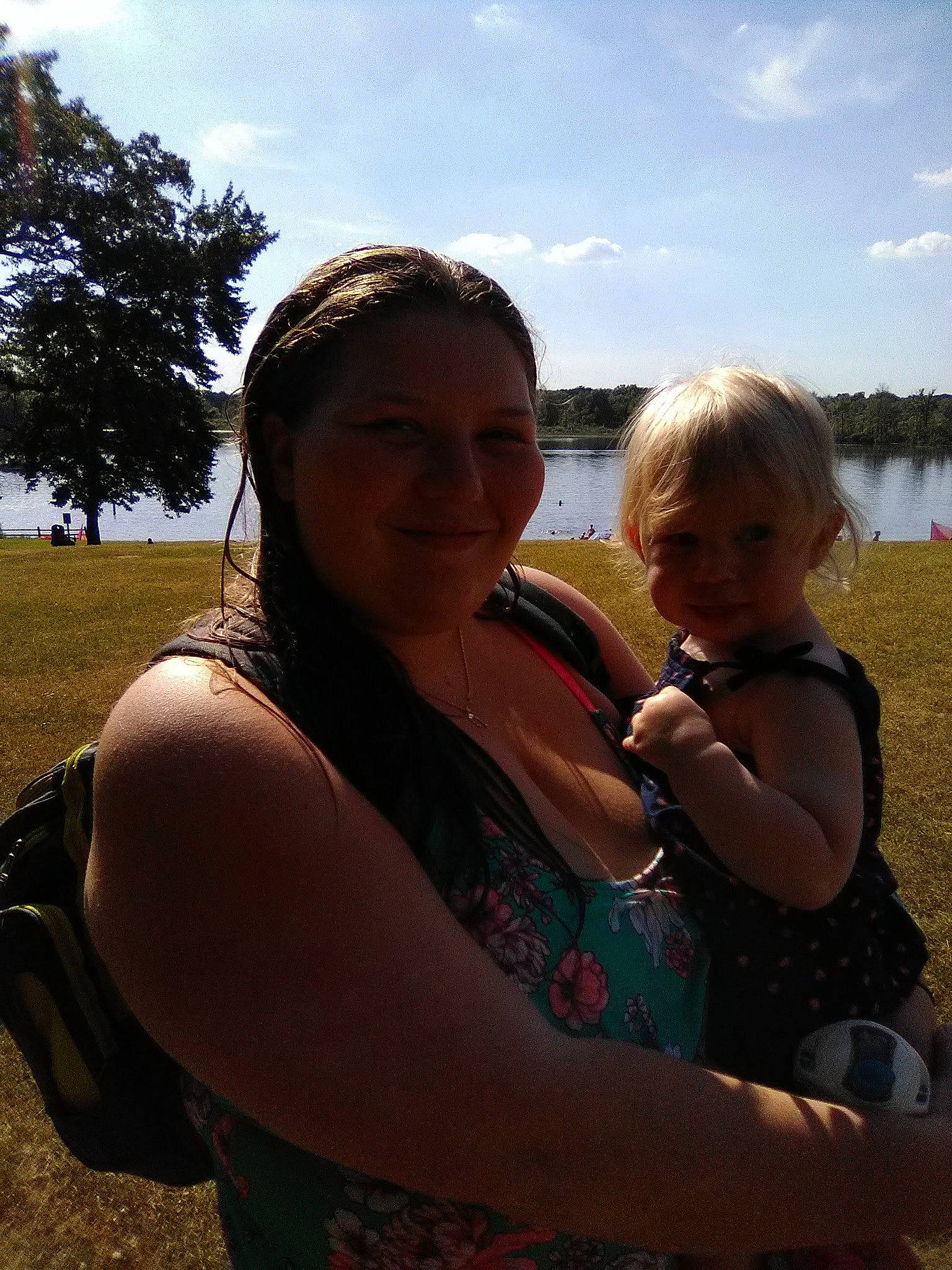 Katherine is registered to the contest to win money with this photo: abdomen, arm, baby, cloud, fawn, fun, gesture, grass, happy, iris, joy, lake, leisure, people_in_nature, person, skin, sky, smile, sunlight, toddler