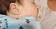 Levi Mathew is registered to the contest to win money with this photo: baby, pacifier, sleeping, blanket, blue, triangle_pattern, closeup, side_profile, child, infant, human, person, resting, cozy, comfort, indoor, clothing, soft, peaceful, portrait