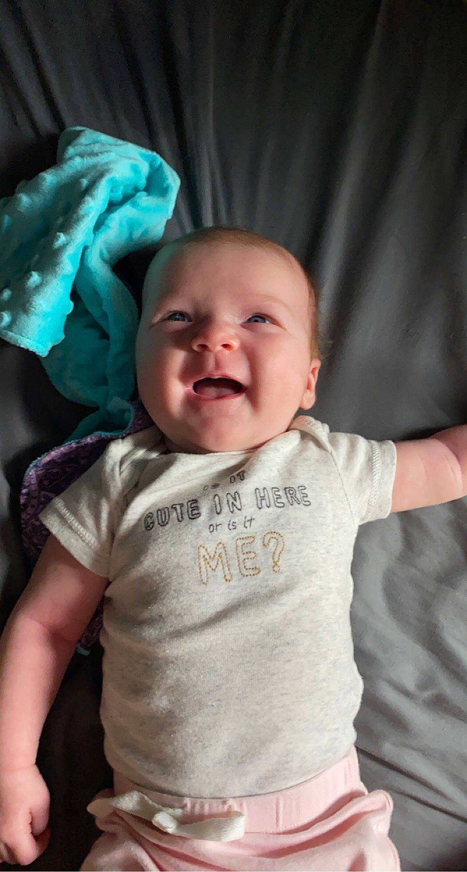 Primrose is registered to the contest to win money with this photo: baby, baby_toddler_clothing, cheek, chin, eye, facial_expression, hairstyle, head, human, iris, lip, mammal, mouth, nose, person, product, skin, sleeve, smile, standing