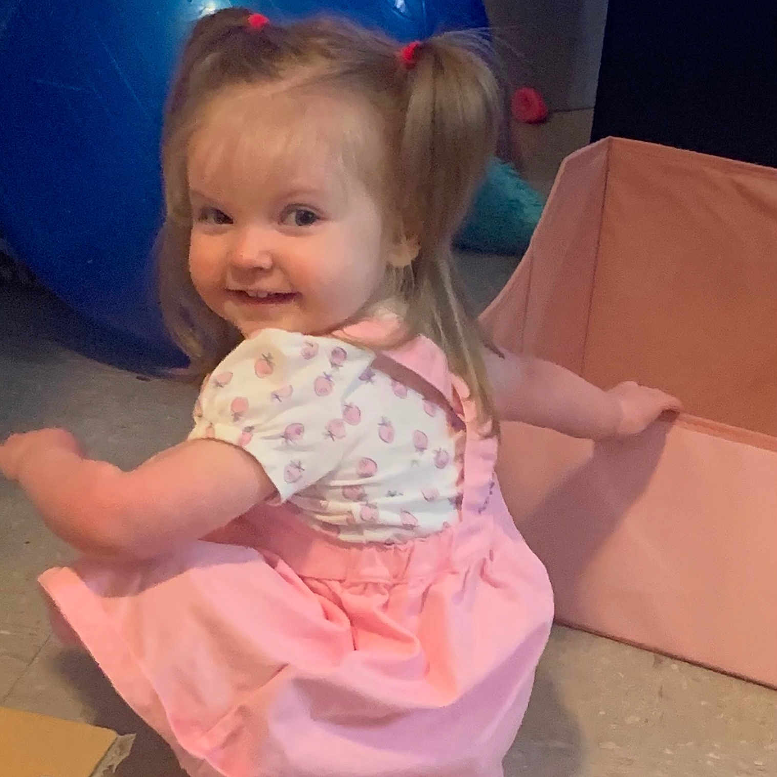 Melody is registered to the contest to win money with this photo: baby, balloon, box, child, clothing, dress, face, female, furniture, girl, hair, happy, head, indoors, openingpresent, person, photography, portrait, sitting, smile