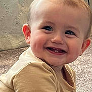 Oakley is registered to the contest to win money with this photo: baby, smile, teeth, child, happy, face, person, infant, cute, young, indoor, carpet, clothing, sitting, cheeks, light, skin, head, eyes, ears