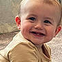 baby, smile, teeth, child, happy, face, person, infant, cute, young, indoor, carpet, clothing, sitting, cheeks, light, skin, head, eyes, ears