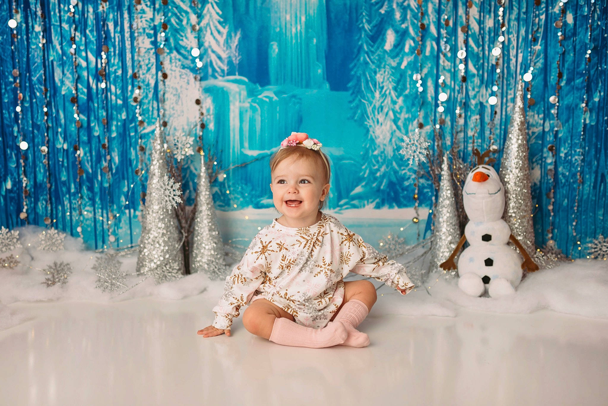 Reagan is registered to the contest to win money with this photo: azure, baby, blue, child, electric_blue, event, flash_photography, freezing, fun, happy, joy, leisure, people_in_nature, person, photograph, room, snowman, standing, textile, toddler