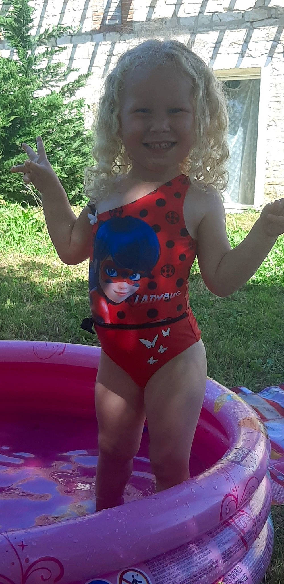 Kaylie participe au concours pour gagner de l'argent avec cette photo : baby_toddler_clothing, child, facial_expression, fun, happy, joy, leisure, leotard, maillot, one_piece_swimsuit, person, photograph, pink, plant, recreation, smile, sportswear, summer, swimwear, thigh