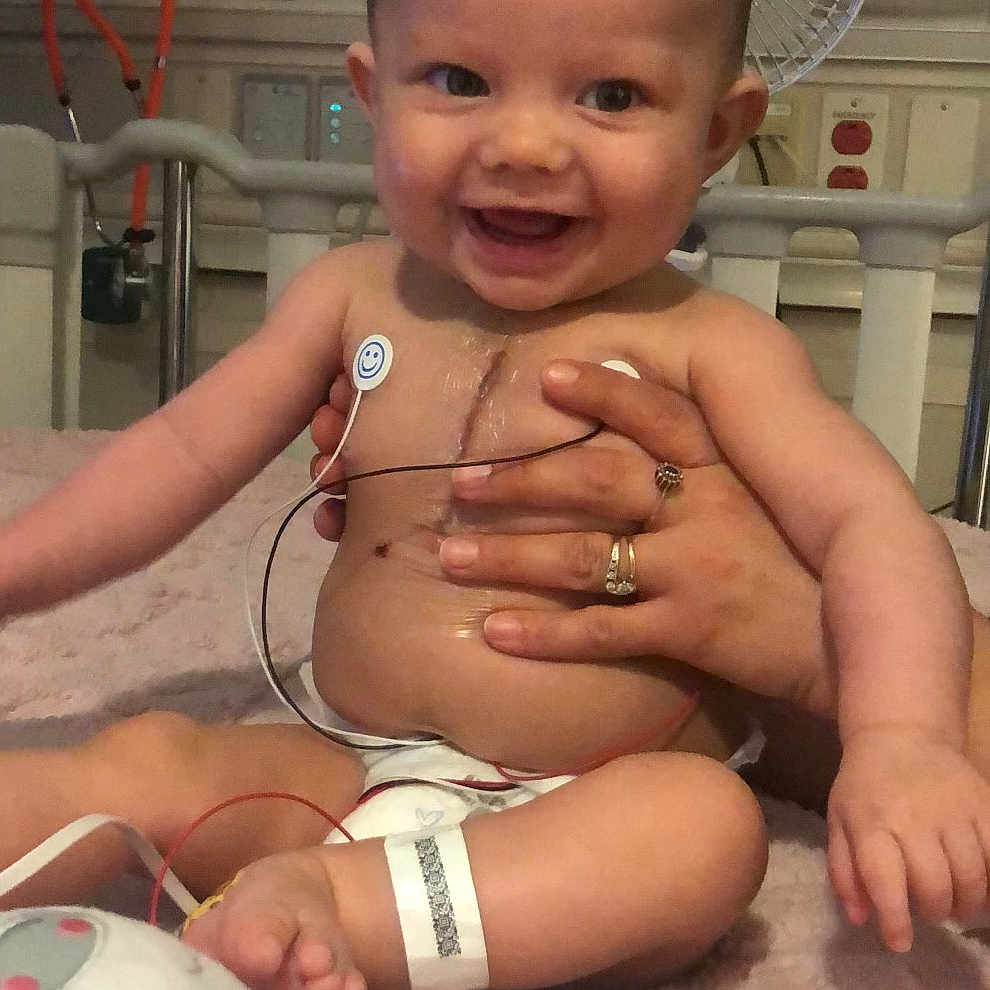 Khalia is registered to the contest to win money with this photo: accessories, architecture, baby, bodypart, building, face, finger, furniture, hand, happy, head, hospital, indoors, jewelry, necklace, newborn, person, photography, portrait, smile