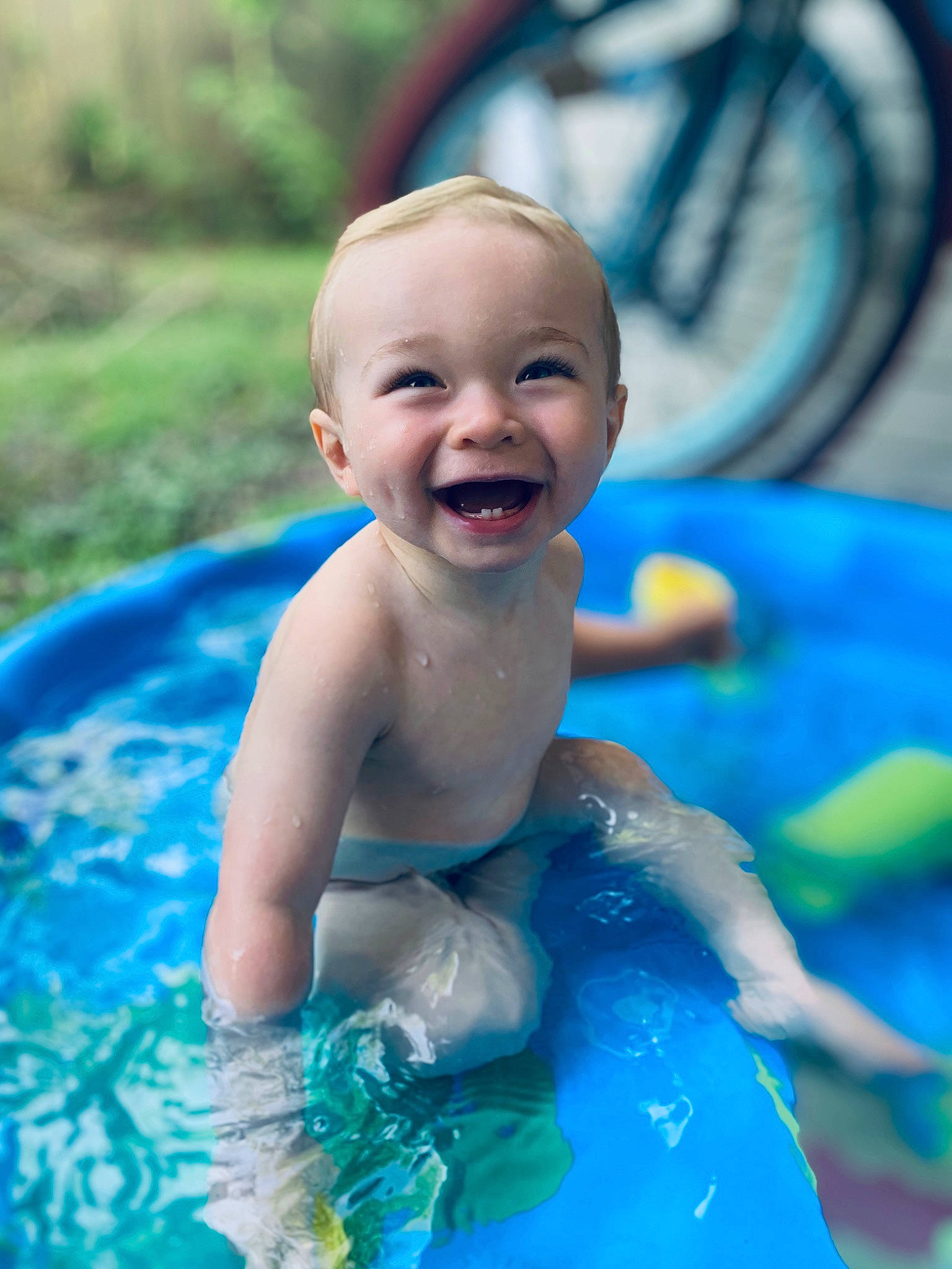 Brendan joined the competition — help win amazing prizes! baby, baby_bathing, blue, child, eye, face, facial_expression, fun, games, inflatable, joy, leisure, person, play, product, recreation, skin, smile, summer, swimming_pool