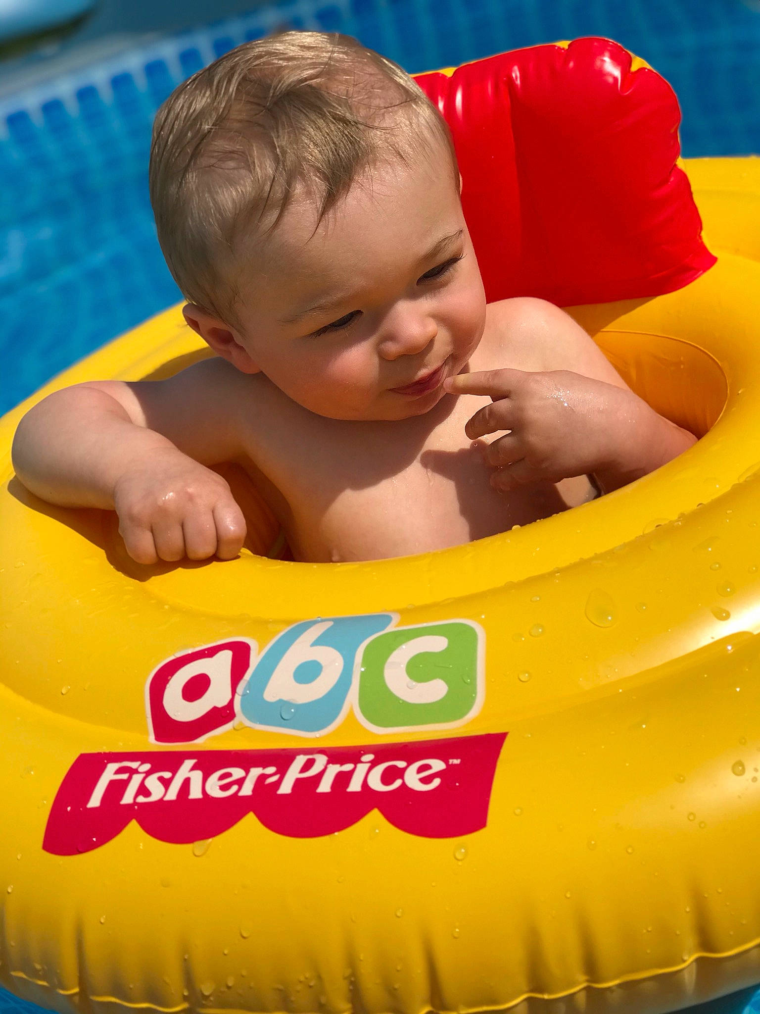 Brendan is registered to the contest to win money with this photo: baby, baby_float, baby_products, child, fun, games, inflatable, leisure, person, play, product, recreation, toddler, toy, yellow