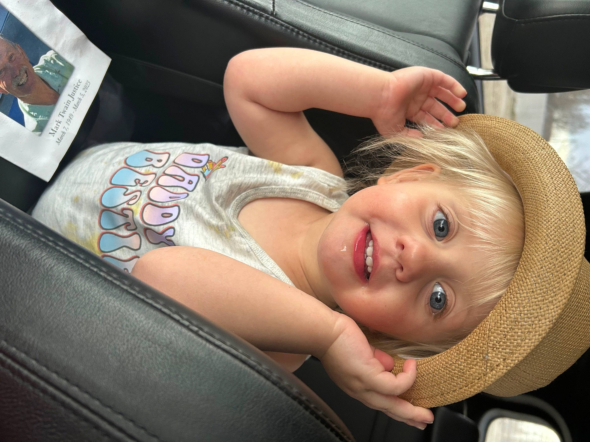 Jordyn is registered to the contest to win money with this photo: blond, car_seat, chest, child, comfort, cool, elbow, fun, happy, headwear, human_leg, joint, joy, mouth, neck, person, shoulder, sitting, skin, smile
