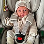 baby, infant, car_seat, seat_belt, hat, knitwear, sock, cute, child, child_seat, safety, straps, face, small_person, cozy, apparel, car_interior, cute_hat, newborn, portrait