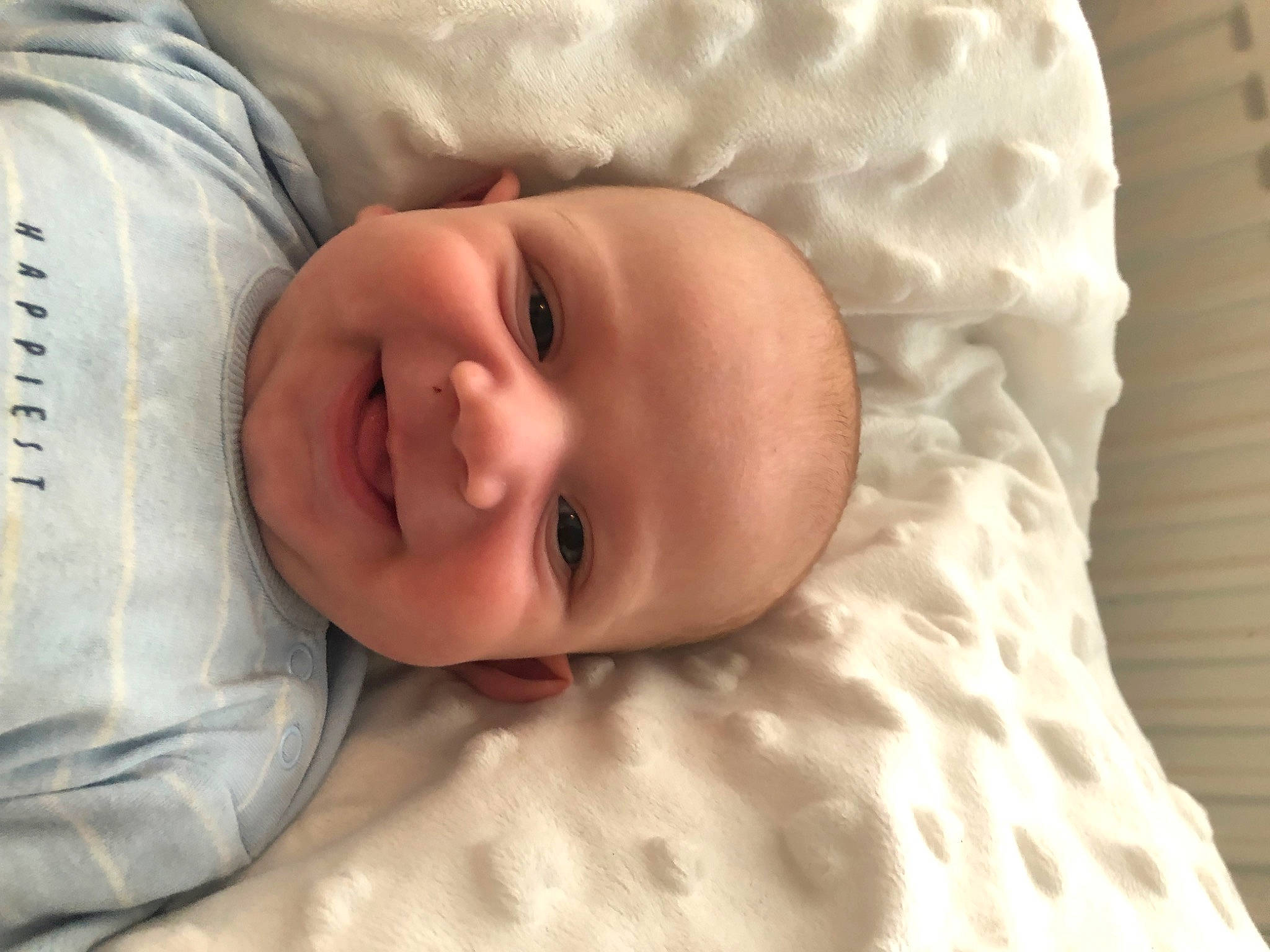Kyson is registered to the contest to win money with this photo: baby, baby_toddler_clothing, bedtime, cheek, child, chin, comfort, eye, eyebrow, happy, iris, joy, linens, mouth, nose, person, room, skin, sleeve, smile