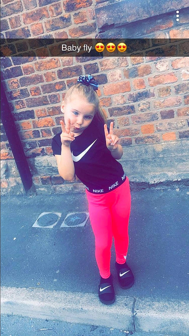 Ellie-mae is registered to the contest to win money with this photo: arm, child, cool, leisure, person, photography, physical_fitness, pink, smile, sportswear, standing, t_shirt, trousers, vacation, yoga_pant
