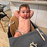 baby, infant, child, high_chair, kitchen, indoor, sitting, portrait, face, eyes, hair, smile, messy, food, food_stains, fruit, pacifier, spoon, baby_gear, home