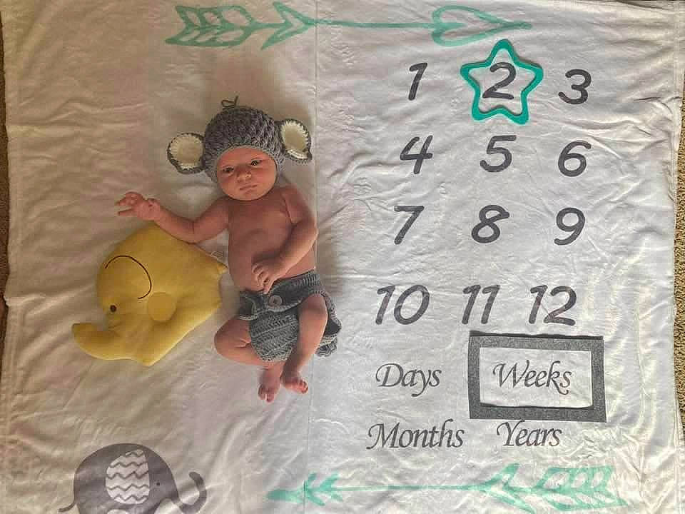 Dasean is registered to the contest to win money with this photo: baby, baby_toddler_clothing, child, font, handwriting, happy, headwear, linens, pattern, person, product, room, sleeve, t_shirt, textile, toddler
