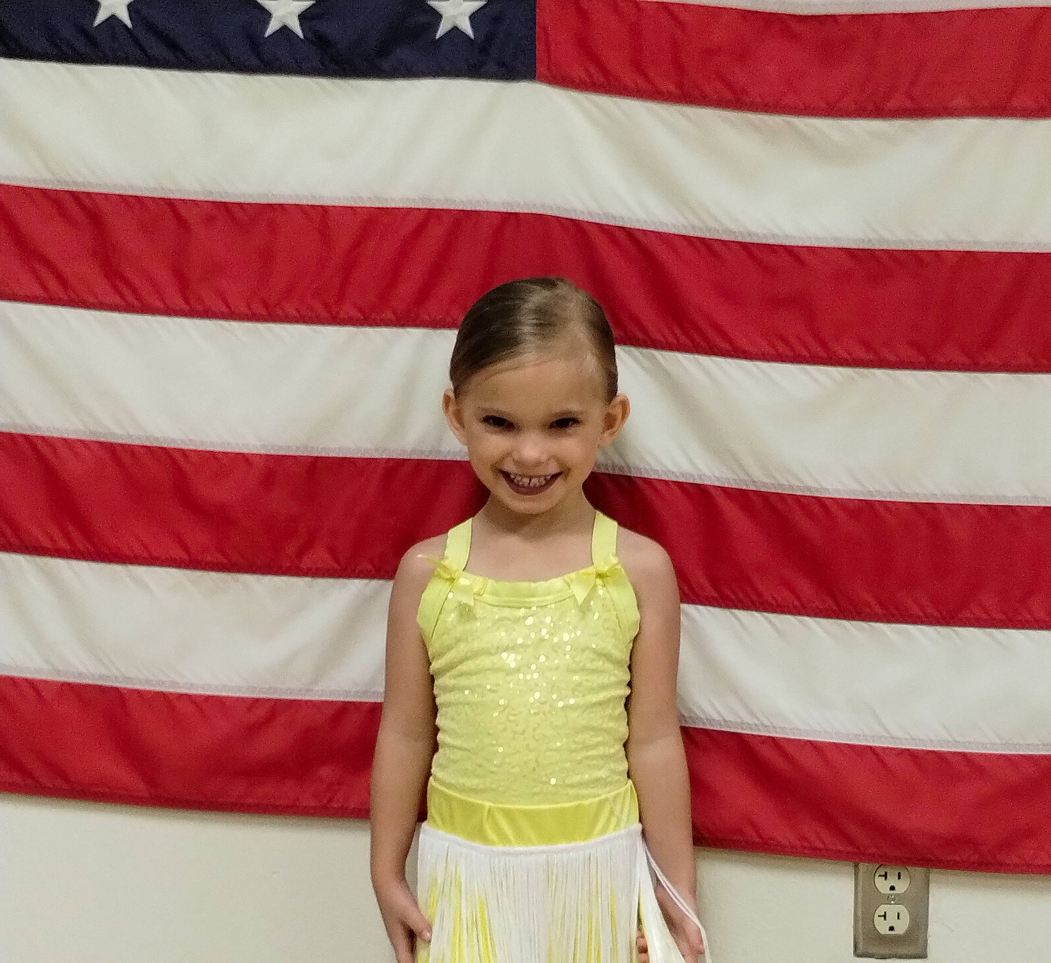 Kylie is registered to the contest to win money with this photo: baby_toddler_clothing, beauty, child, event, eye, face, facial_expression, fashion_design, flag, flag_day_usa, flag_of_the_united_states, fun, happy, head, joy, magenta, person, red, sleeve, smile