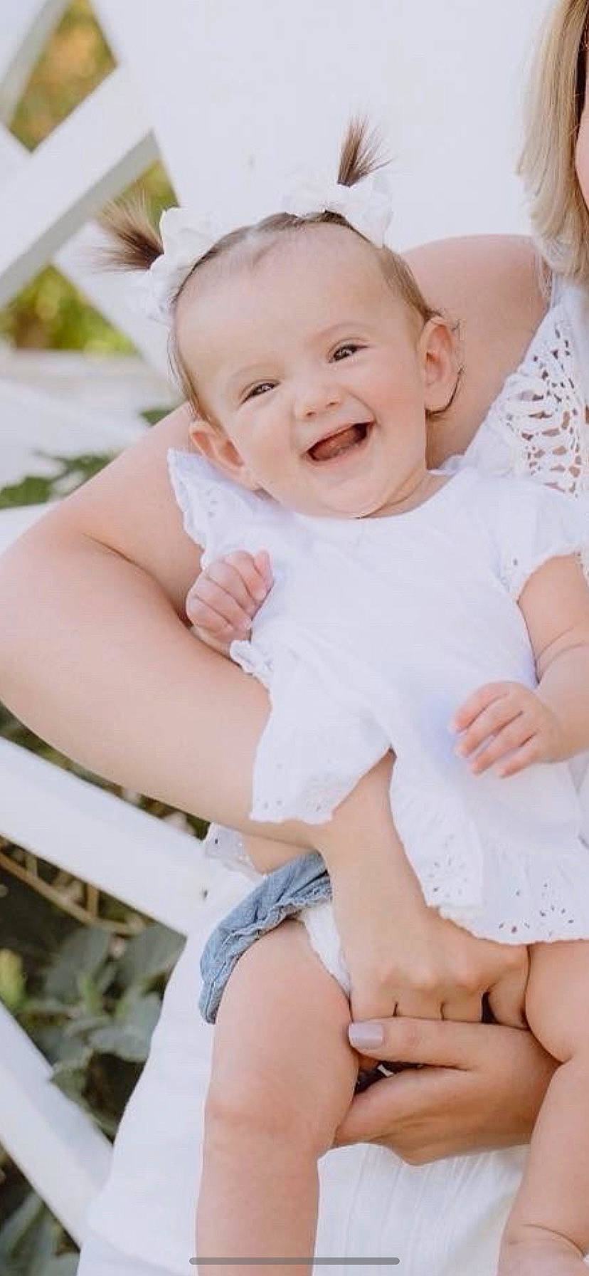Layla is registered to the contest to win money with this photo: arm, baby, baby_toddler_clothing, cheek, child, eye, face, facial_expression, finger, flash_photography, gesture, happy, joy, person, photograph, pink, skin, sleeve, smile, thigh