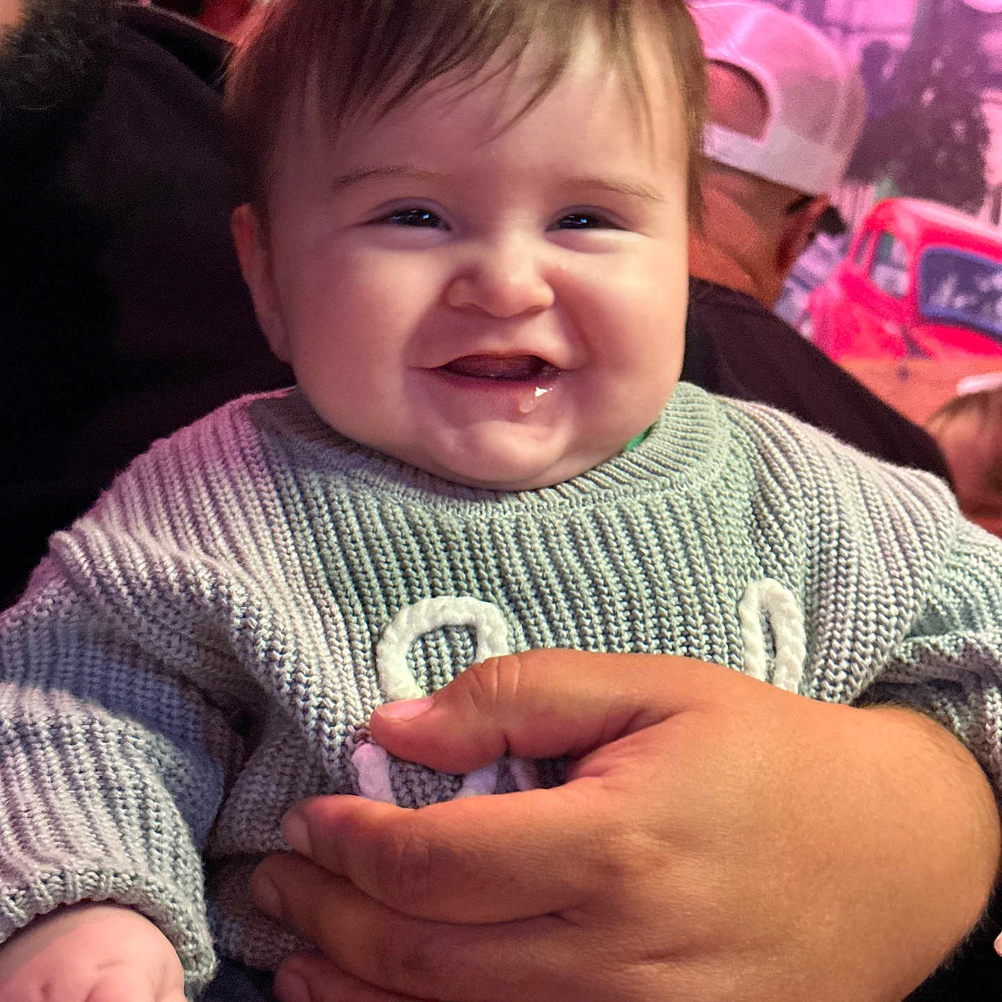 Joel joined the competition — help win amazing prizes! baby, bodypart, cap, car, clothing, face, finger, hand, happy, hat, head, knitwear, laughing, person, photography, portrait, smile, sweater, transportation, vehicle