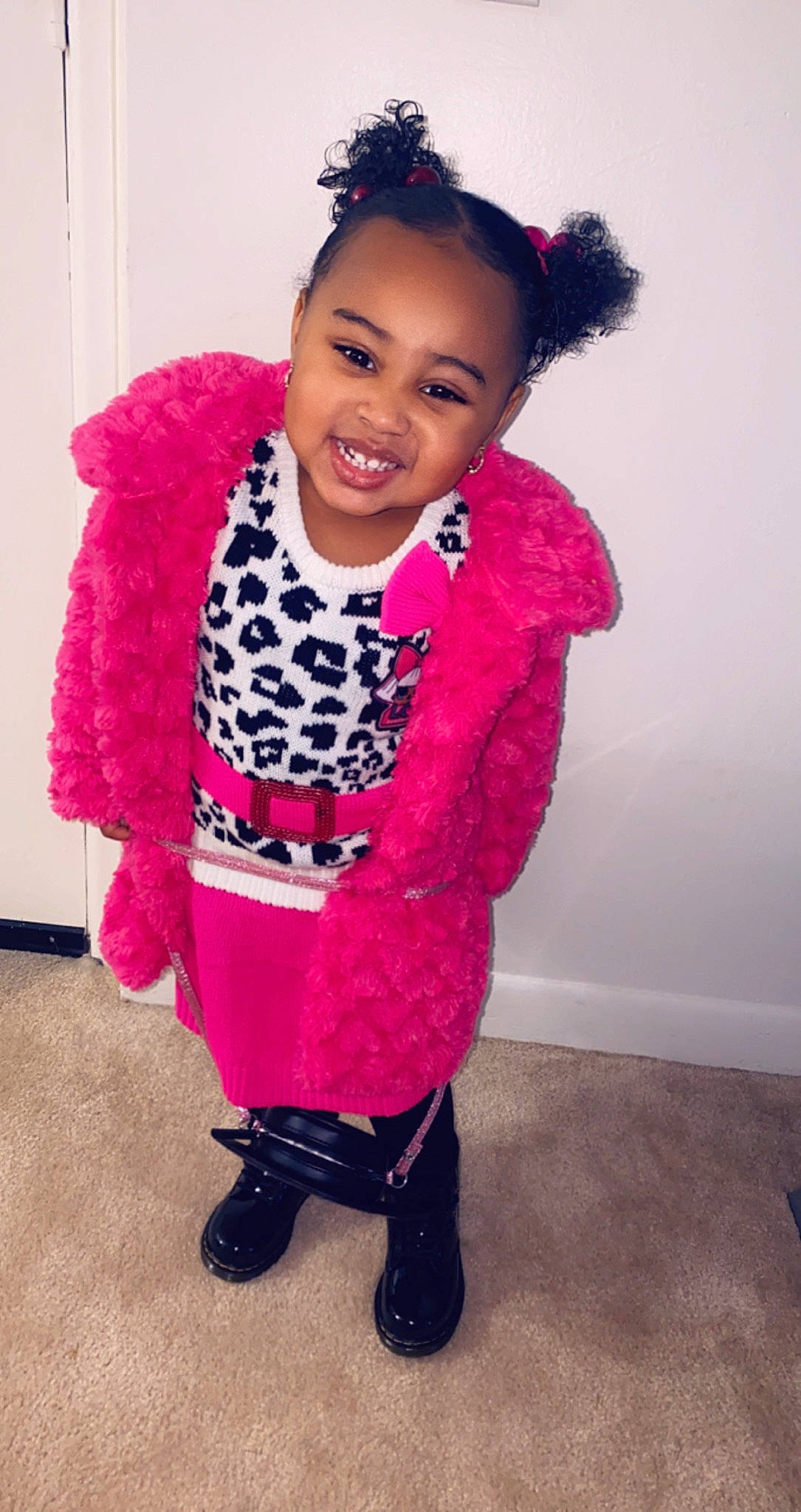Jai'La is registered to the contest to win money with this photo: baby_toddler_clothing, child, clothing, cool, face, fashion_accessory, fashion_design, fur, happy, headgear, joy, lipstick, magenta, pattern, person, pink, purple, shoe, sleeve, smile