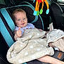 Eyma participe au concours pour gagner de l'argent avec cette photo : baby, blanket, blue_eyes, car_interior, car_seat, child, clothing, comfort, cute, headrest, infant, person, plush, polka_dot, seatbelt, smiling, soft_toy, thumbs_up, toy, window