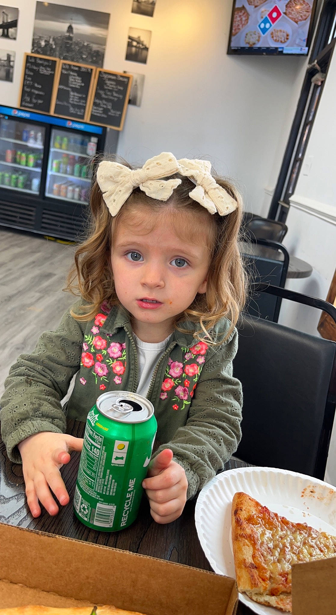 Macy joined the competition — help win amazing prizes! baseball_cap, cap, chair, child, comfort_food, dish, drink, drinking, drinkware, food, fun, happy, headwear, ingredient, person, plate, sitting, snapshot, sweetness, table