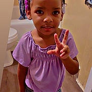 Ahriayah joined the competition — help win amazing prizes! child, girl, toddler, portrait, smiling, happy, indoor, bathroom, purple_shirt, denim_shorts, hair_rollers, braids, hairstyle, hand_gesture, three_fingers, standing, sandals, white_socks, curtain, home