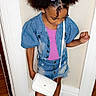 Deasia is registered to the contest to win money with this photo: child, girl, toddler, portrait, standing, fashion, denim, jacket, shorts, pink_shirt, hair_bows, flower_clips, curly_hair, purse, handbag, black_shoes, indoor, doorway, carpet, smiling