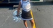 Deasia joined the competition — help win amazing prizes! child, cheerleader, smiling, portrait, outdoor, sunlight, pom_pom, uniform, bow, sport, school_spirit, parking_lot, trailer, team, standing, posing, girl, athlete, cheerleading, happy
