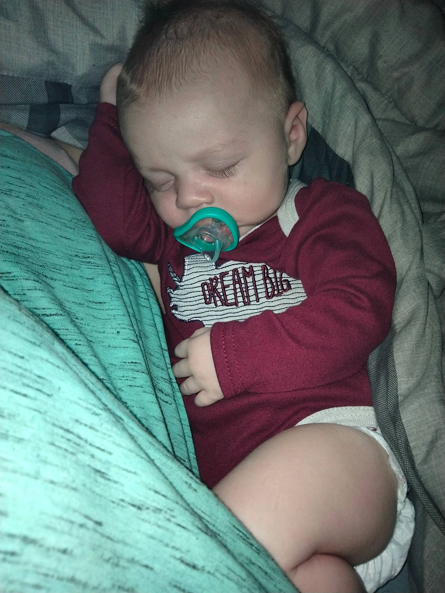 Oliver is registered to the contest to win money with this photo: baby, baby_toddler_clothing, cheek, comfort, ear, elbow, eyebrow, flash_photography, grass, happy, iris, lip, mouth, nose, person, sitting, sleeve, t_shirt, thigh, toddler