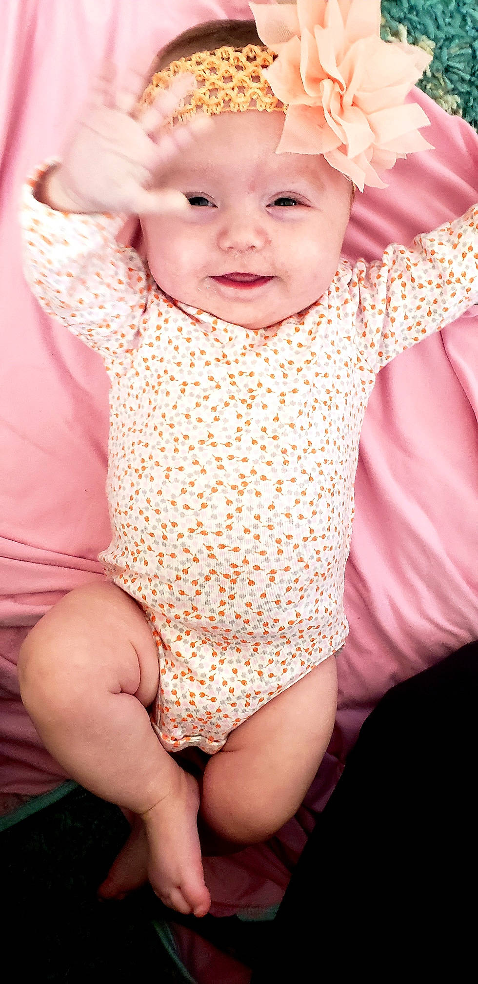 Natalie Rose is registered to the contest to win money with this photo: baby, baby_products, baby_toddler_clothing, beauty, cheek, child, child_model, design, face, head, pattern, person, pink, product, sitting, skin, sleeve, smile, toddler
