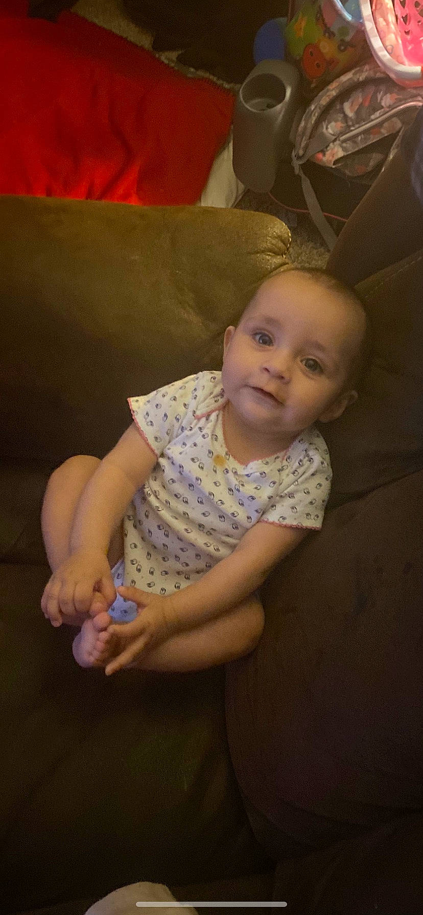 Aleah is registered to the contest to win money with this photo: baby, baby_toddler_clothing, cheek, child, chin, comfort, elbow, finger, flash_photography, flooring, fun, human_leg, iris, pattern, person, sitting, skin, sleeve, thumb, toddler