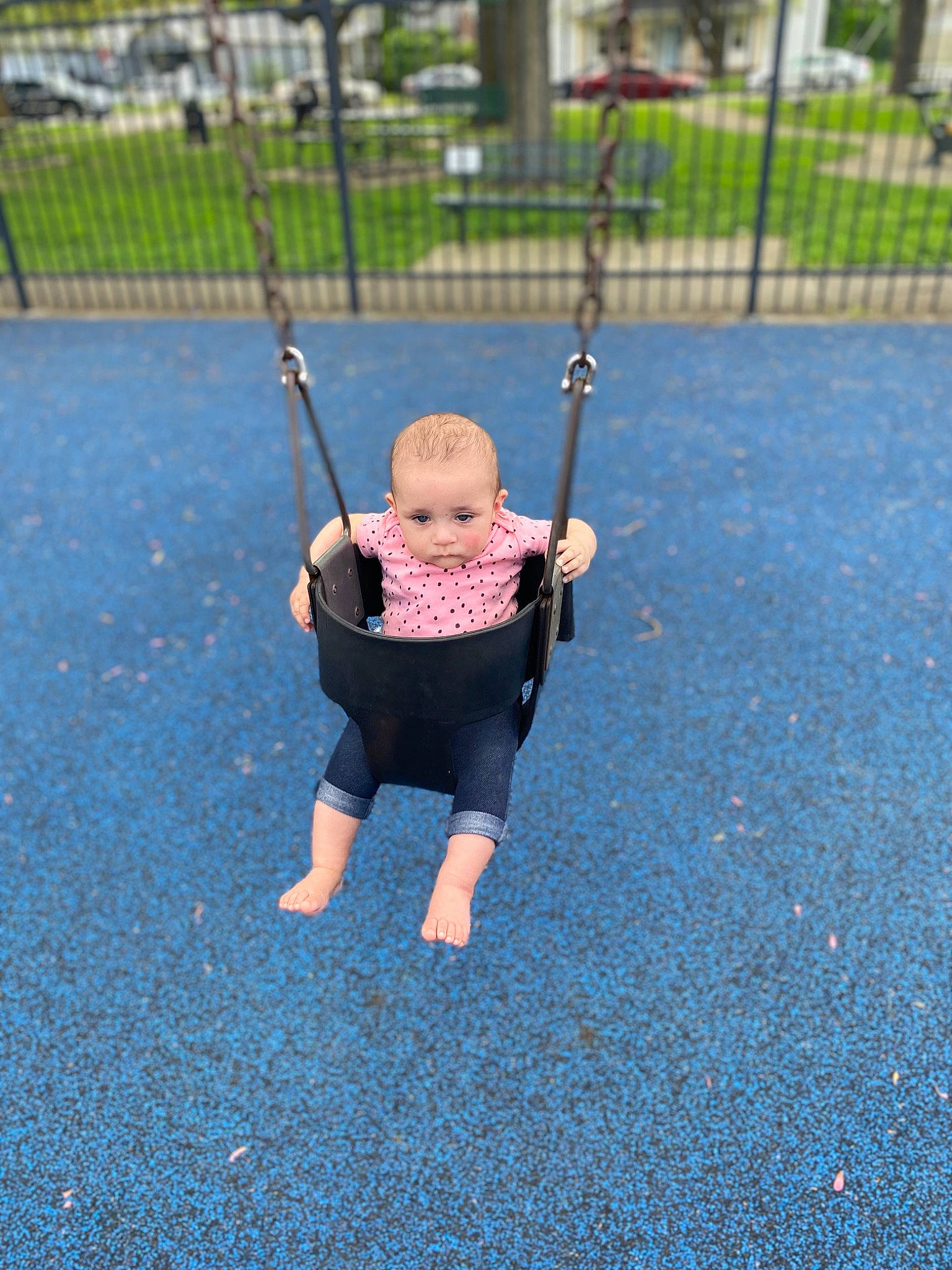 Aleah is registered to the contest to win money with this photo: asphalt, baby, baby_toddler_clothing, child, city, electric_blue, fence, fun, grass, leisure, outdoor_play_equipment, person, plant, play, playground, recreation, road_surface, swing, t_shirt, toddler