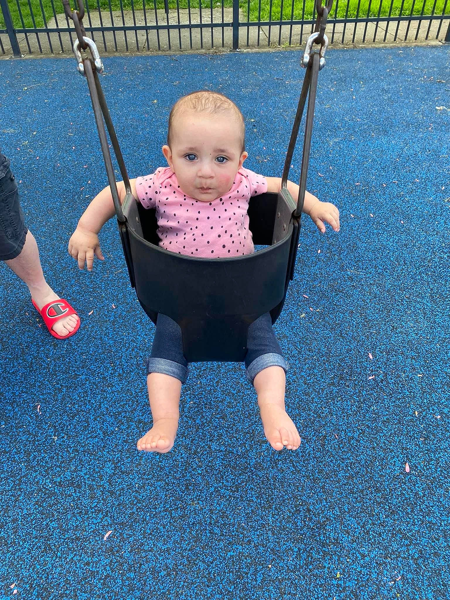 Aleah is registered to the contest to win money with this photo: baby, baby_products, baby_toddler_clothing, blue, child, city, electric_blue, fence, fun, grass, human_body, leisure, people_in_nature, person, playground, recreation, sitting, smile, swing, toddler