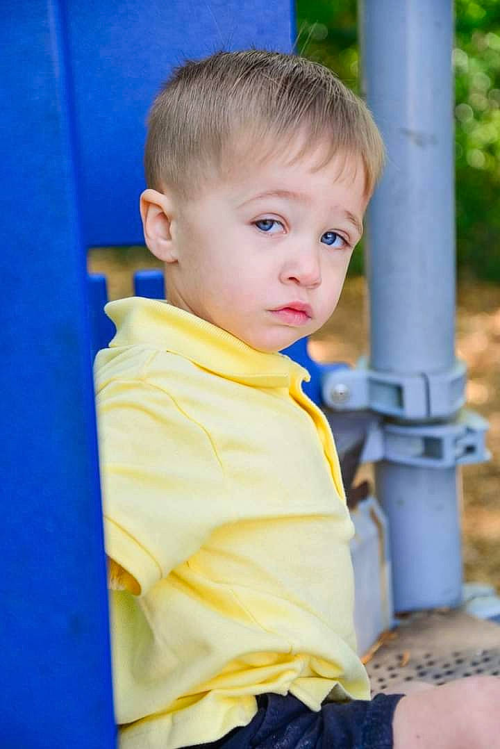 Avery is registered to the contest to win money with this photo: baby, blue, cheek, child, child_model, chin, eye, face, head, male, person, photography, play, skin, smile, standing, toddler, vacation, yellow