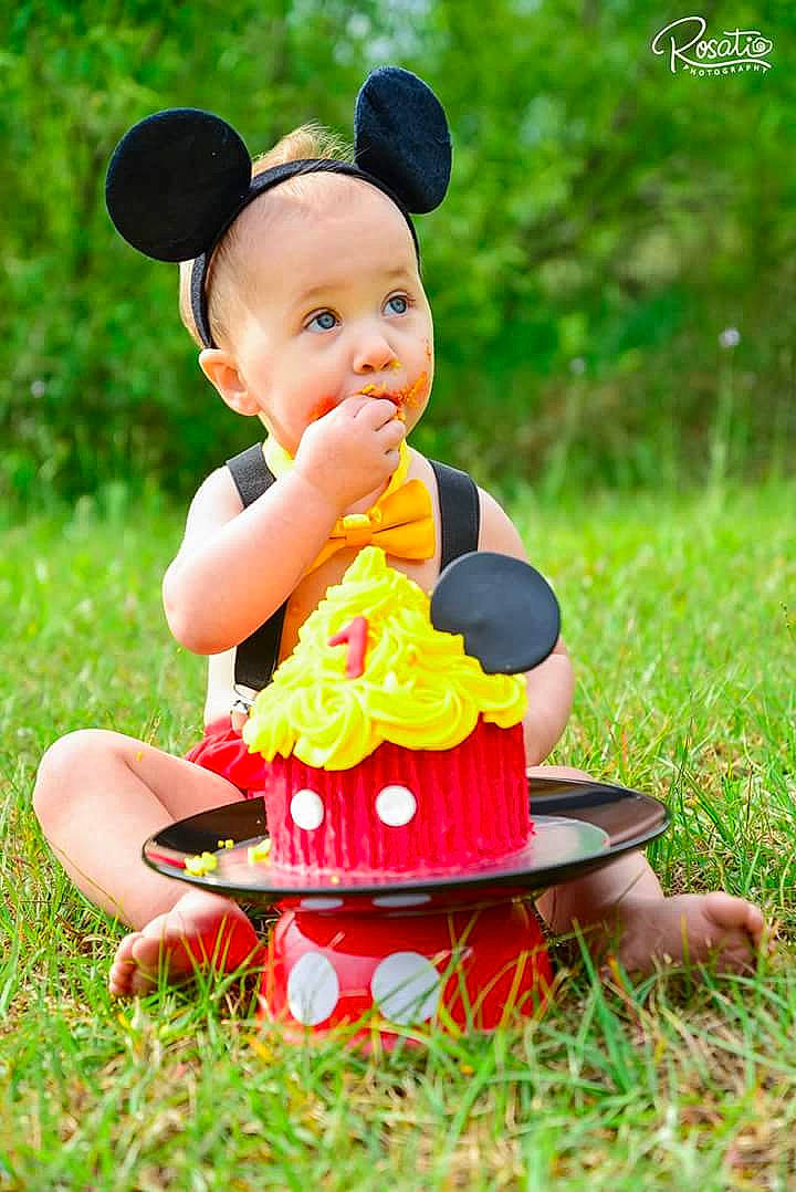 Avery joined the competition — help win amazing prizes! baby, child, child_model, costume, dress, fashion_accessory, fun, grass, happy, headgear, leisure, person, photography, play, sitting, smile, surprise, toddler, yellow