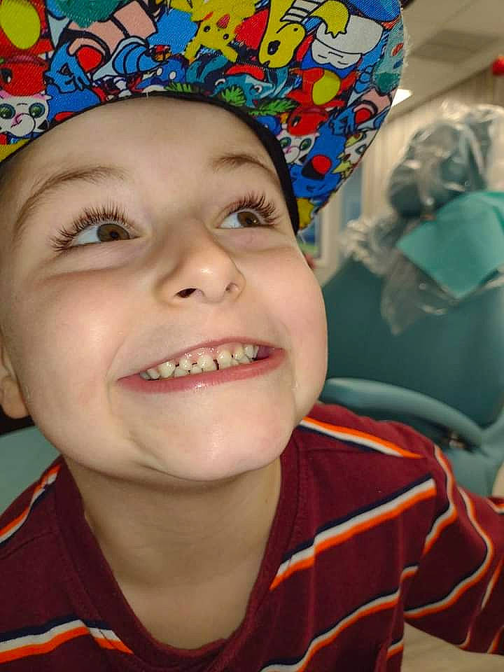 Aiden is registered to the contest to win money with this photo: blue, cap, cheek, chin, cool, eye, eyebrow, eyelash, fun, happy, headwear, human, iris, jaw, joy, lip, mouth, nose, orange, person