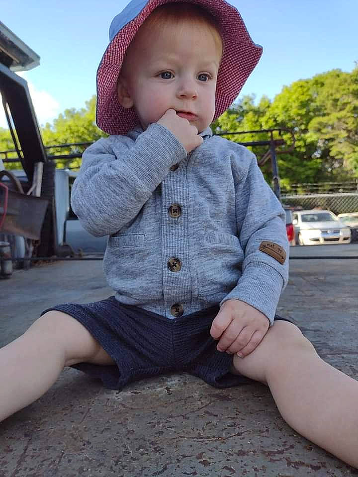 Lincoln joined the competition — help win amazing prizes! baby, baby_toddler_clothing, cap, child, fun, grass, hat, leg, leisure, lip, outerwear, pattern, person, photograph, plaid, skin, sky, sleeve, sun_hat, toddler