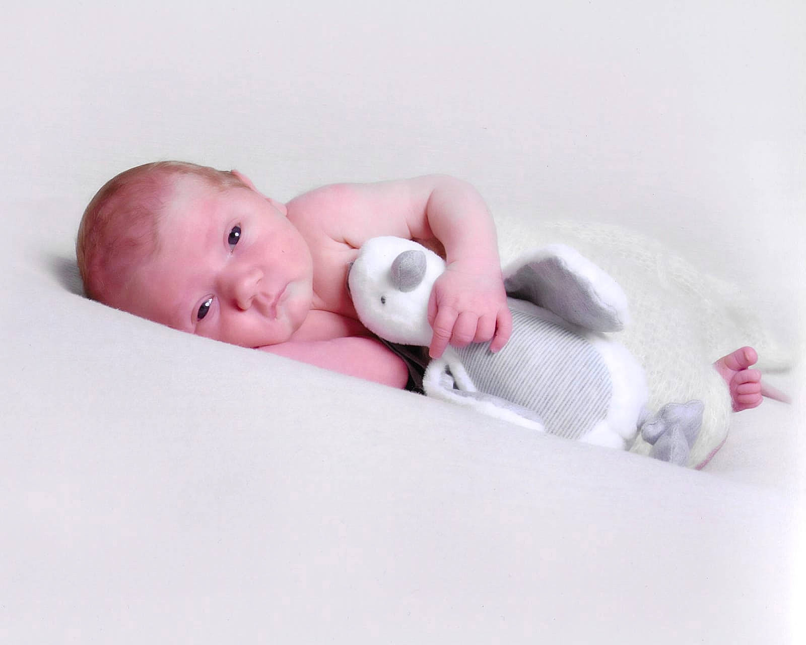 Faye is registered to the contest to win money with this photo: baby, baby_products, baby_sleeping, baby_toddler_clothing, cheek, child, comfort, eye, eyelash, fashion_accessory, flash_photography, happy, head, linens, lip, person, pink, sitting, skin, sleeve