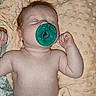 Oaklynn is registered to the contest to win money with this photo: baby, pacifier, blanket, diaper, sleeping, infant, skin, hand, face, bed, soft, texture, peaceful, lying_down, cute, child, newborn, resting, indoors, comfort