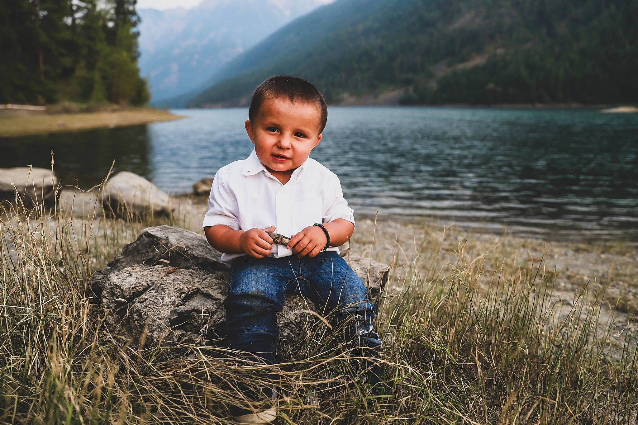 Kelson joined the competition — help win amazing prizes! child, fun, grass, happy, lake, lake_district, loch, mountain, natural_landscape, people, people_in_nature, person, photography, reservoir, sitting, smile, summer, toddler, tree, vacation