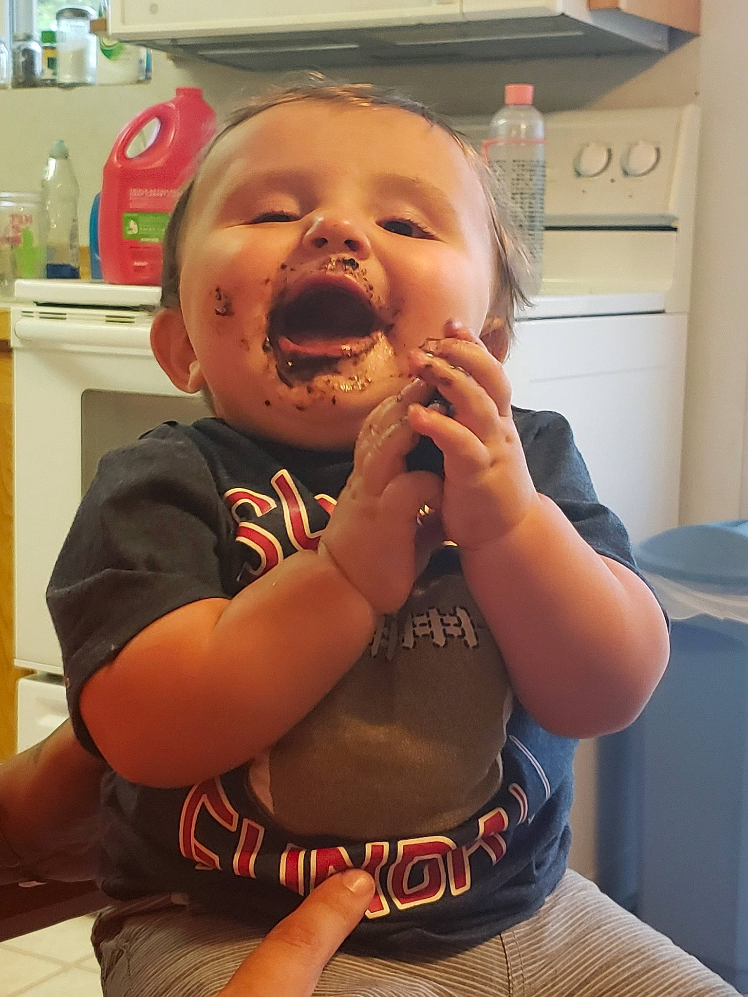 Kelson joined the competition — help win amazing prizes! arm, baby, child, eating, face, facial_expression, finger, head, mouth, person, smile, toddler, tooth