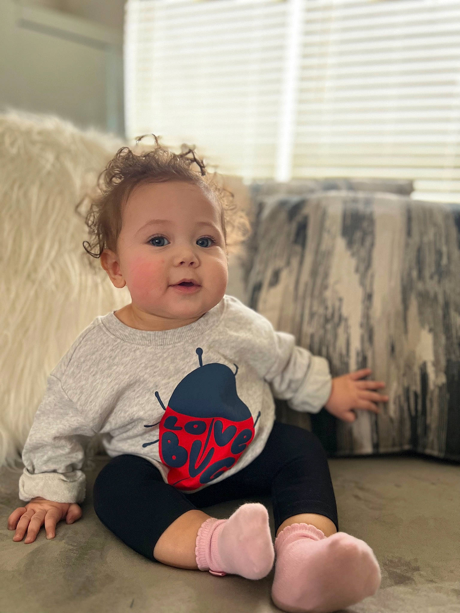 Ezra is registered to the contest to win money with this photo: baby, baby_toddler_clothing, blond, cheek, comfort, eye, flash_photography, floor, flooring, fun, happy, hardwood, human_leg, knee, person, skin, sleeve, smile, t_shirt, toddler