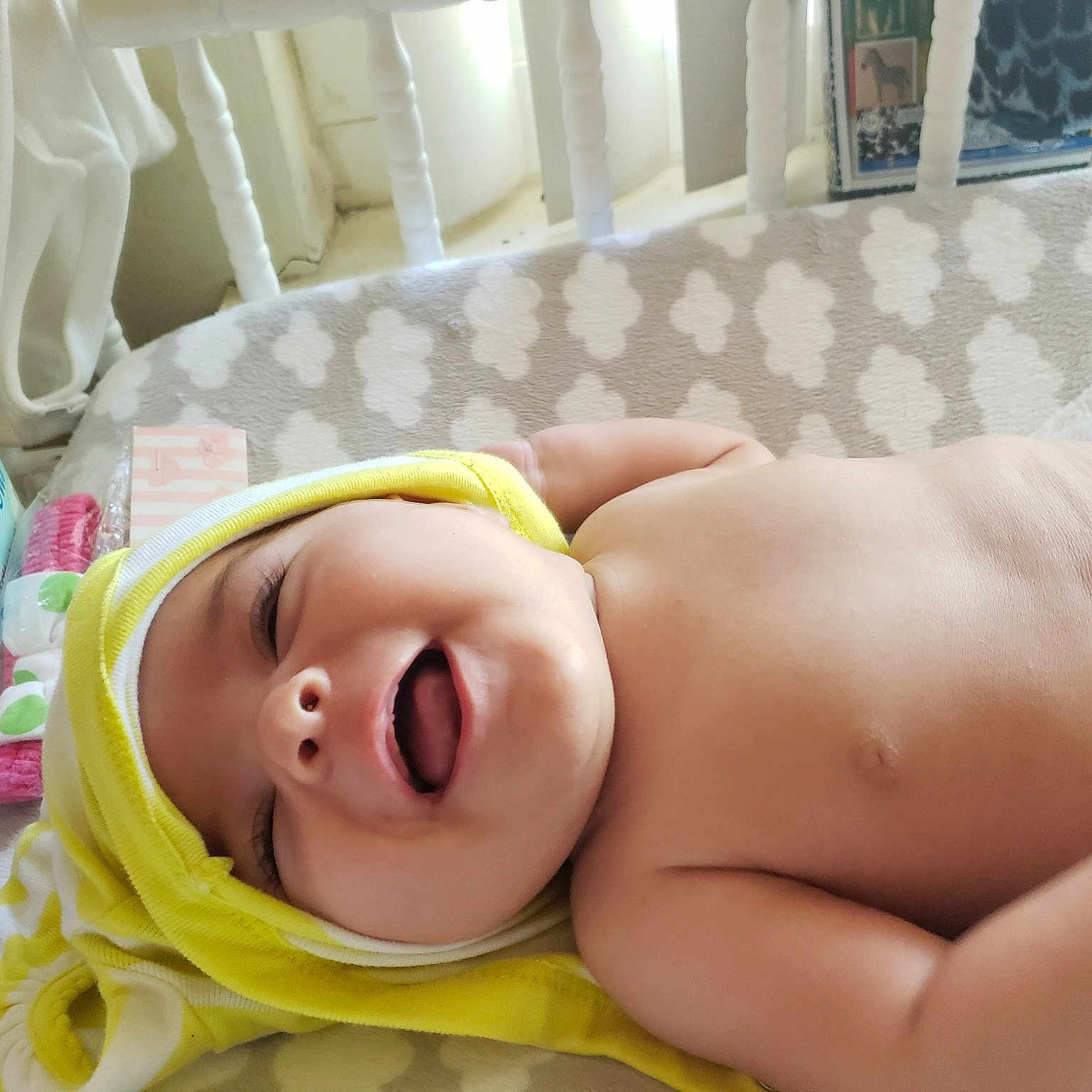 Hinson is registered to the contest to win money with this photo: baby, child, close_up, hand, mouth, neck, skin, smile, toddler, yellow