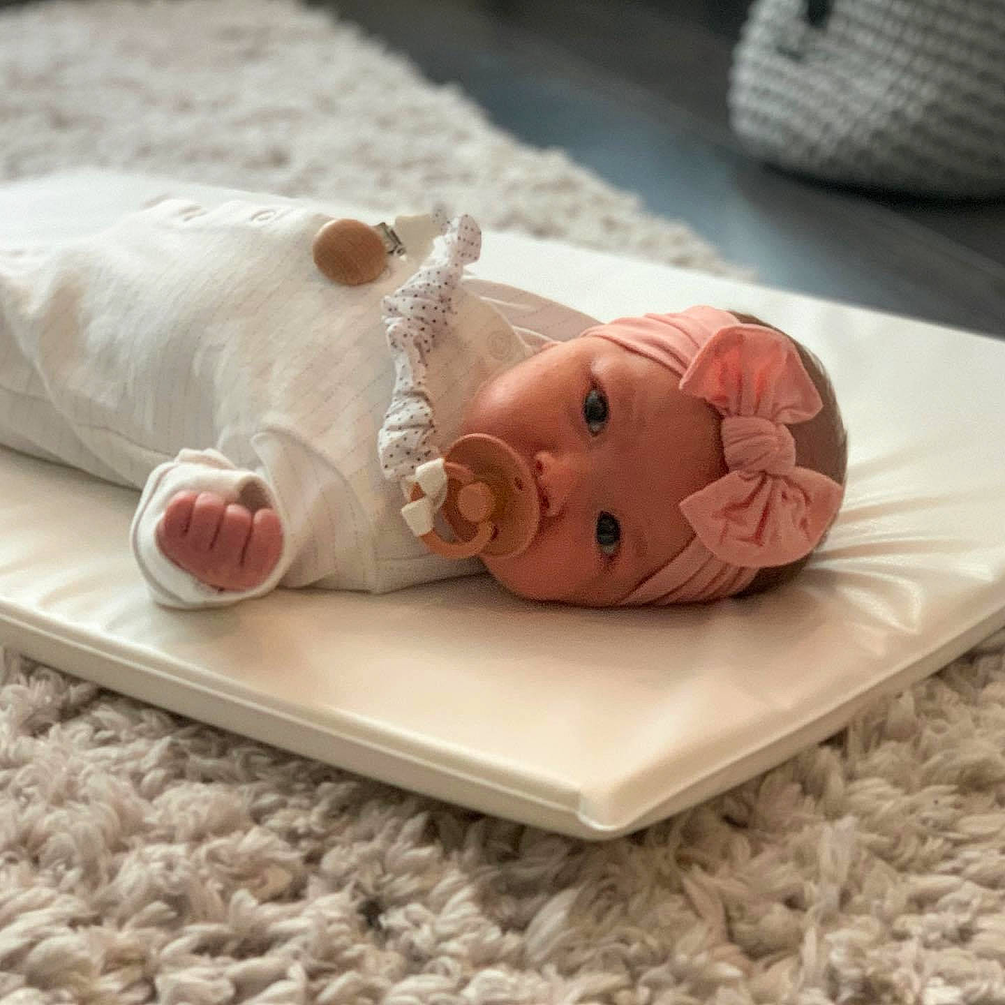 Edith is registered to the contest to win money with this photo: baby, baby_sleeping, child, domestic_pig, headgear, headwear, person, product, suidae, toddler