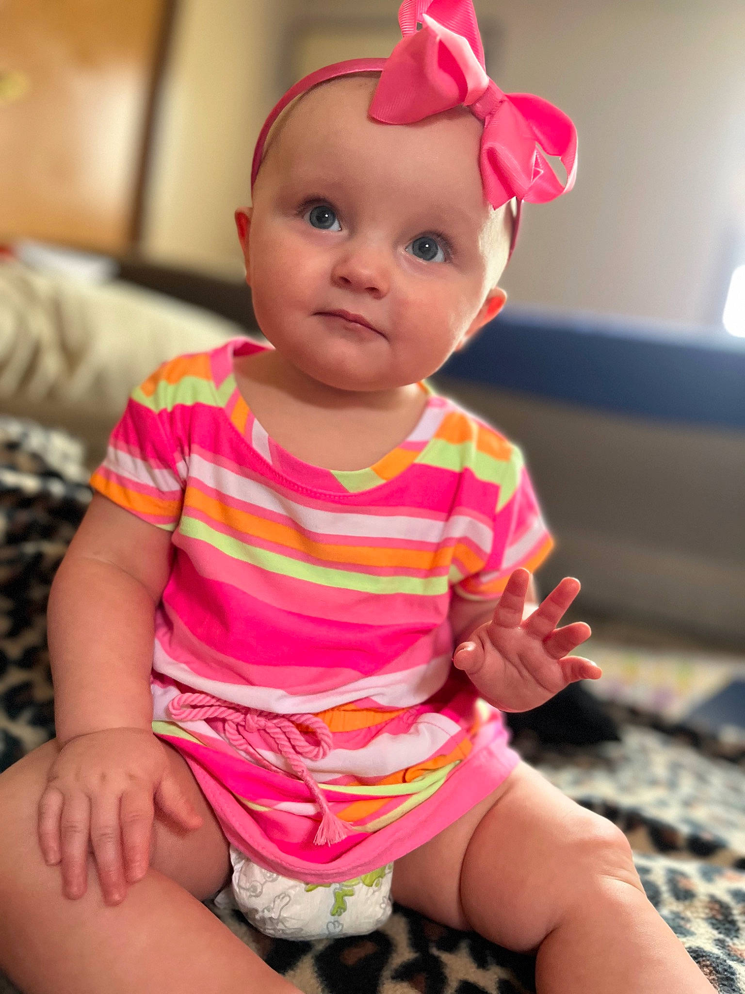 Charlie is registered to the contest to win money with this photo: baby, baby_toddler_clothing, cheek, eye, face, facial_expression, fun, happy, human_body, lip, magenta, nose, person, pink, red, skin, sleeve, smile, thigh, toddler