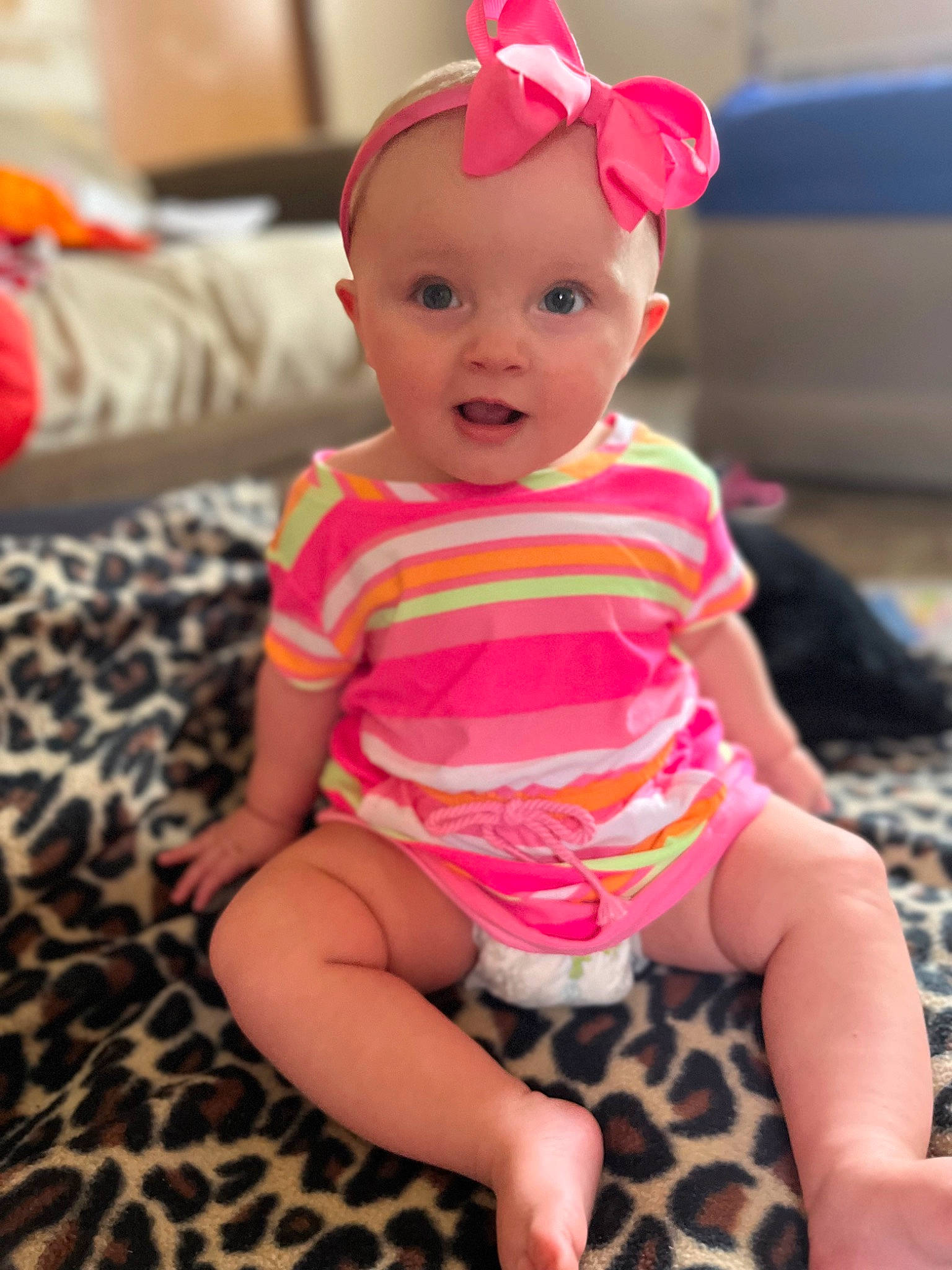 Charlie is registered to the contest to win money with this photo: baby, baby_toddler_clothing, cheek, clothing, eye, facial_expression, finger, fun, happy, head, magenta, mouth, person, pink, red, skin, sleeve, smile, standing, surprise