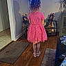 child, girl, pink_dress, curly_hair, living_room, television, wooden_floor, rug, shelf, photoframe, shoes, remote_control, couch, vase, flowers, doorway, carpet, toy, home_interior, animation