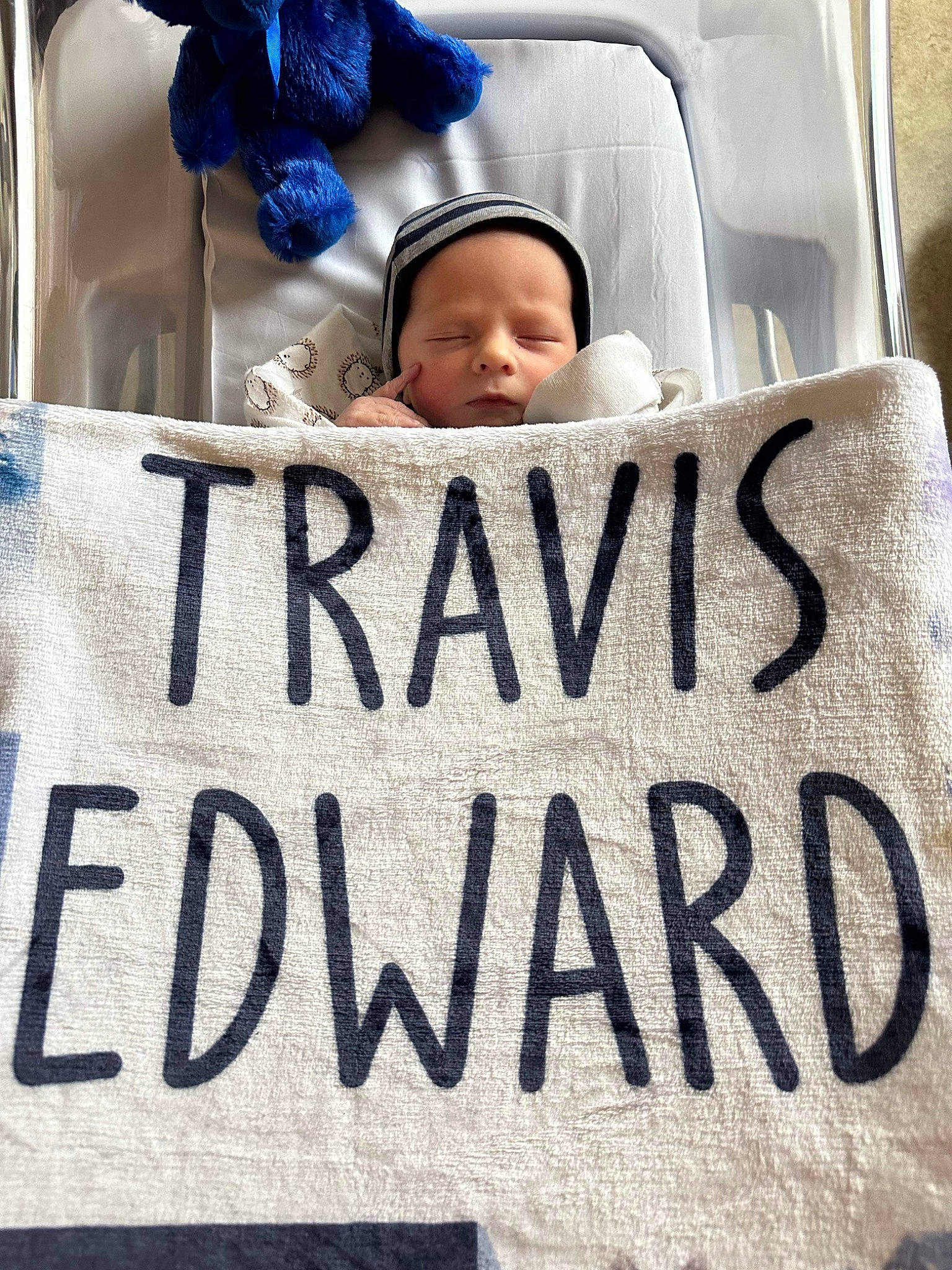 Travis is registered to the contest to win money with this photo: baby, baby_products, baby_sleeping, child, comfort, event, font, fur, handwriting, happy, hat, human, linens, people, person, photograph, product, public_event, snapshot, toddler